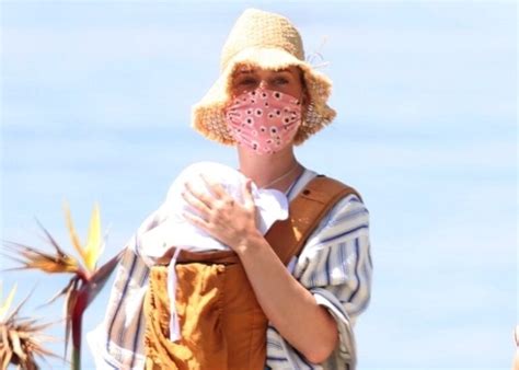 Pop star Katy Perry walks with her baby Daisy Dove on the beach in ...