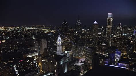 5K stock footage aerial video of a reverse view of Downtown Philadelphia skyscrapers and City ...