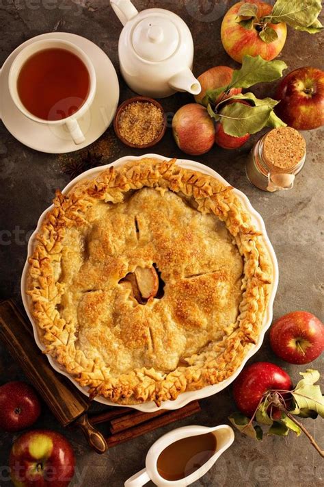 Apple pie decorated with fall leaves 15759649 Stock Photo at Vecteezy