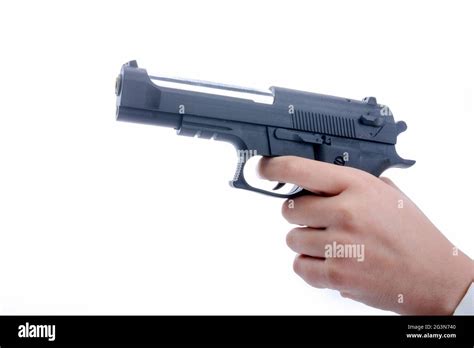 Hand holding and pointing a gun Stock Photo - Alamy