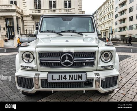 AMG Mercedes Benz G-class car in white, face-on view, parked in ...