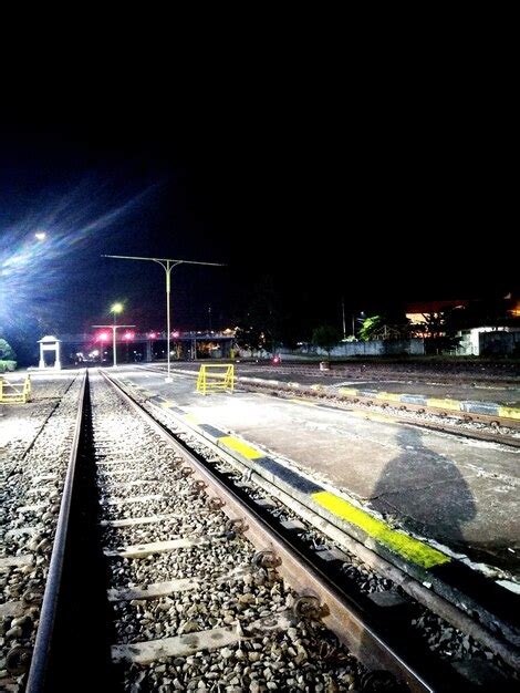 Premium Photo | Train at railroad station at night