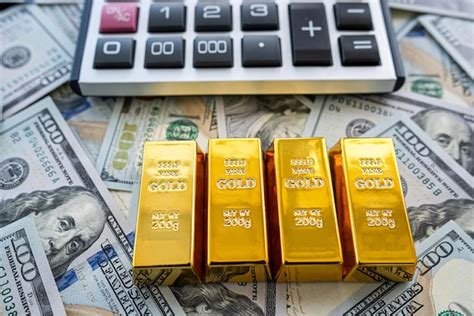 Premium Photo | Gold bullion over 100 us dollar money investment and ...