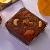 Send Christmas Plum Cake With Scented Candle Gift Online, Rs.1095 | FlowerAura