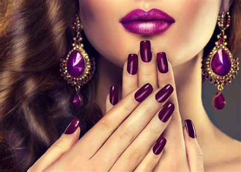 Luxury fashion style, manicure nail , cosmetics and make-up . Jewelry , large purple earrings ...