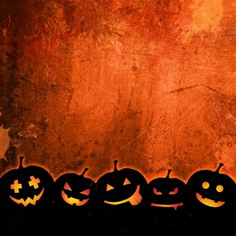 Free Photo | Orange grunge background for halloween with pumpkins