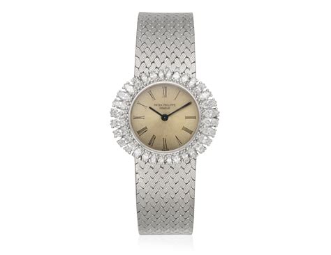 PATEK PHILIPPE DIAMOND SET GOLD WATCH, | Christie’s