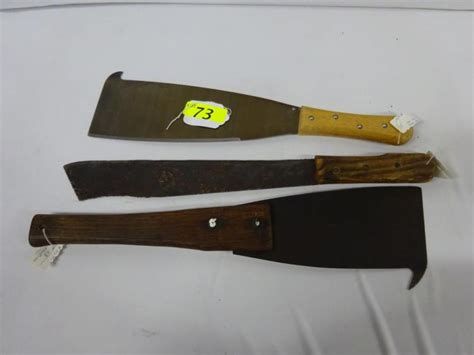 Sold at Auction: (2) SUGAR CANE KNIVES & (1) MACHETE