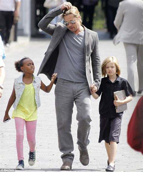 Brad Pitt takes daughters Zahara and Shiloh for a stroll in Moscow in a ...