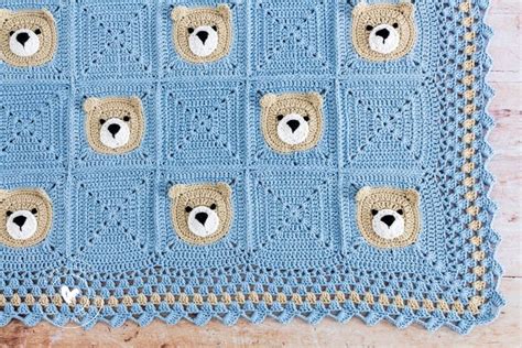 a blue crocheted blanket with teddy bears on the front and sides, in ...