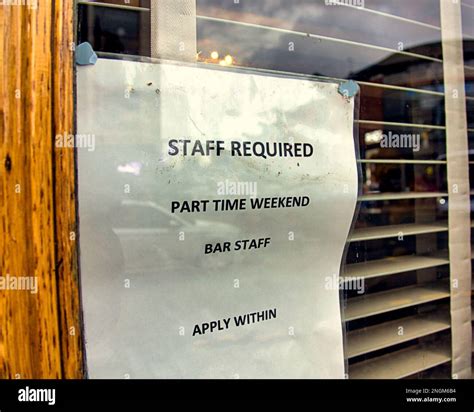 Bar staff required notice in window Stock Photo - Alamy