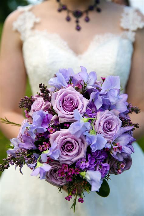 Purple lavender lilac bouquet. Lilac and lavender shades of purple rose bridal bouquet. Photo by ...
