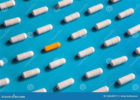 Geometric Pattern Of White Vitamins In Capsules On Light Blue Background Stock Image - Image of ...