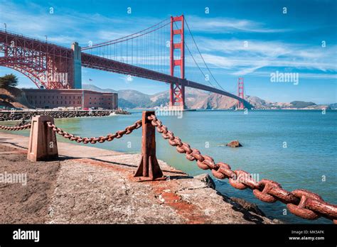 Classic view of famous Golden Gate Bridge with Fort Point National Historic Site on a beautiful ...