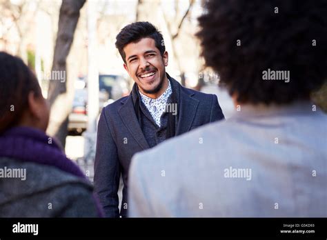 Friends laughing outdoors Stock Photo - Alamy