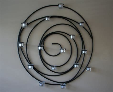 Pottery barn spiral candle holder in living room | Wrought iron candle wall sconces, Iron candle ...