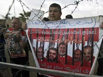 Egypt's Mohamed Morsi faces spying charges as third trial to begin