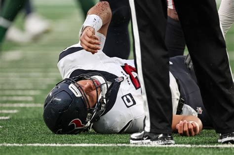 CJ Stroud injury latest — Houston Texans QB taken off the field after going down against the New ...