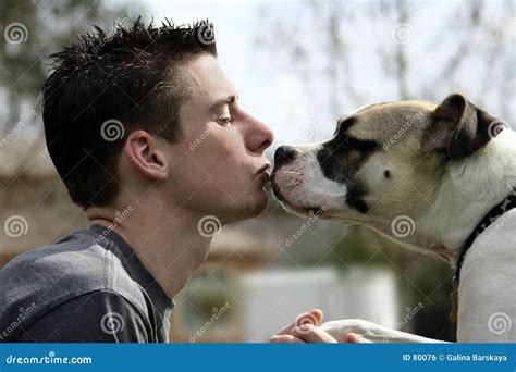 Boy kissing his dog stock photo. Image of breed, dogs, mood - 80076