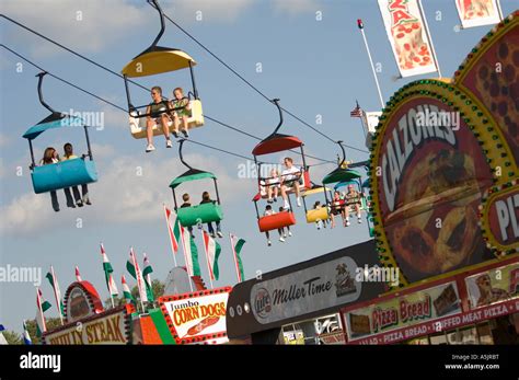 people and rides at the Illinois State Fair in Springfield Illinois ...