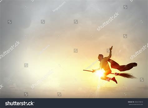 Young Businessman Flying On Broom High Stock Photo 302419610 | Shutterstock