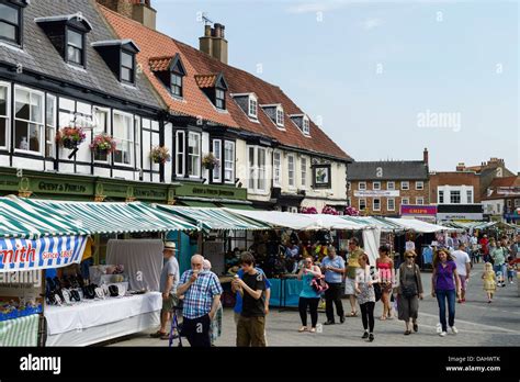 Shoppers browse the market stalls in Beverley town centre UK Stock Photo, Royalty Free Image ...