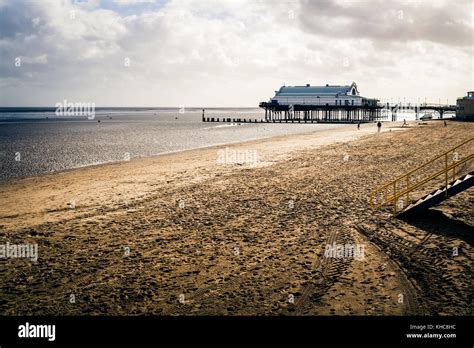 Cleethorpes pier in the background in a view of the promenade and beach ...