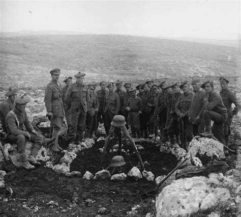 British soldiers pose next to a mass grave for Ottoman soldiers killed ...