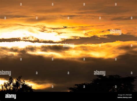 Sunset with Spitfire aircraft silhouette Stock Photo - Alamy