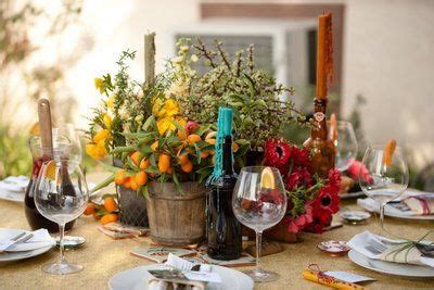 Rustic Spanish table decor - especially love the colored taper candles ...