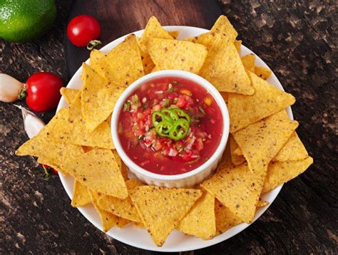 Free Photo | Mexican nacho chips and salsa dip in bowl | Chips and salsa, Nacho chips, Snack chips
