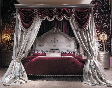 Master bed with canopy and embroidered headboard. Scarlet red