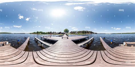 360° view of full seamless panorama 360 by 180 angle view wooden pier for ships on huge forest ...