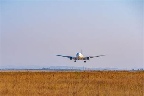 Premium Photo | Passenger plane takes off from runway in airport