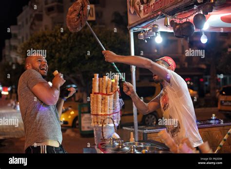 Alanya, Turkey - June 15, 2018: man in turk costume selling traditional turkish icecream on a ...