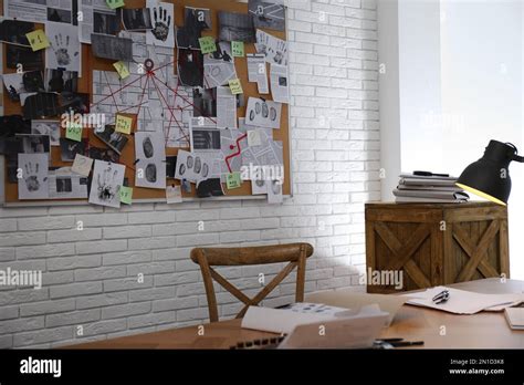 Detective office interior with workplace and investigation board Stock Photo - Alamy