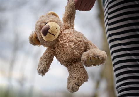 Grayscale Photography of Girl Holding Plush Toy · Free Stock Photo