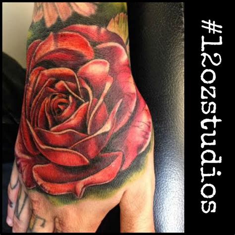 Beautiful red rose male hand tattoo by Meghan | Rose hand tattoo, Black ...