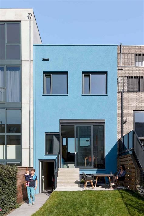 Blue House: A Colorful House with Large Openings and Bright Interiors