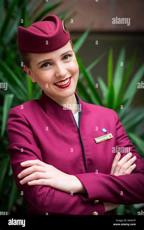 Qatar airways female cabin crew uniform hi-res stock photography and ...