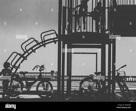 Bicycles Parked By Playground Equipment Stock Photo - Alamy