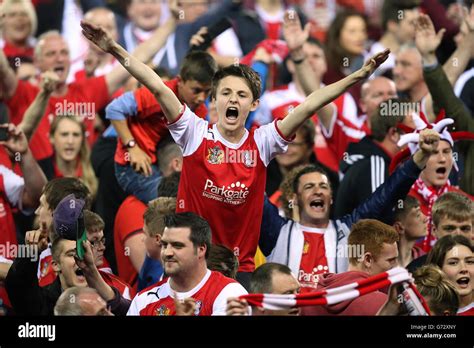 Rotherham United fans celebrate victory on the pitch after the final ...