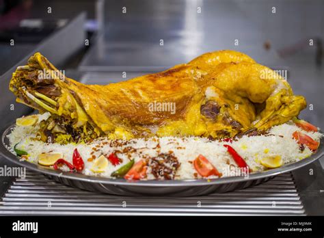 Arabic Roasted chicken with rice "Mandi Stock Photo - Alamy