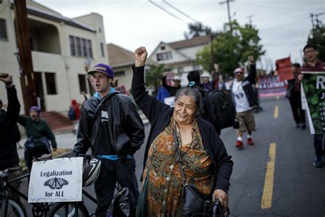 May Day protesters march through downtown L.A. amid gloomy skies and ...