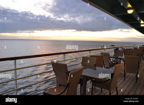 Cruise ship deck at sunset Stock Photo - Alamy