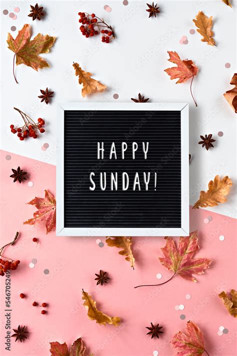 Happy Sunday greeting text on text board. Autumn leaves, spices and ...