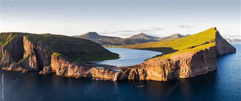 Aerial view from drone of Sorvagsvatn lake on cliffs of Vagar island in ...