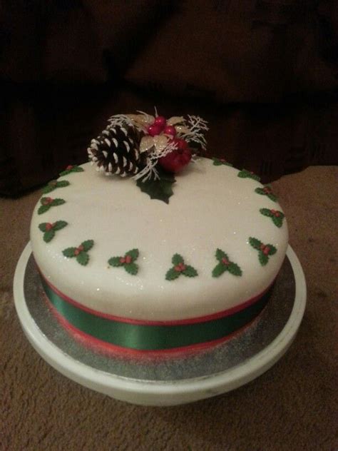 Christmas cake matured with plenty of brandy. Covered with marzipan and fondant icing. Dusted ...