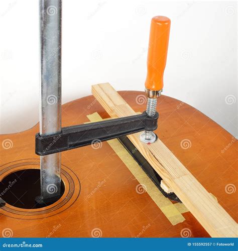 Guitar Repair and Service - Glue Acoustic Guitar Bridge Stock Image - Image of repair, bridge ...