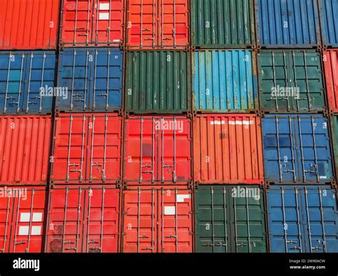 Grid pattern of a tall wall of shipping containers Stock Photo - Alamy